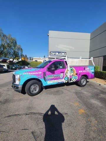 Surf Bros HVAC wrapped service truck fleet ready for San Diego commercial HVAC calls